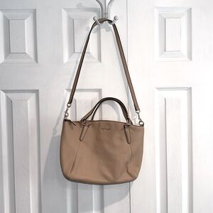 Woman’s coach purse cream color